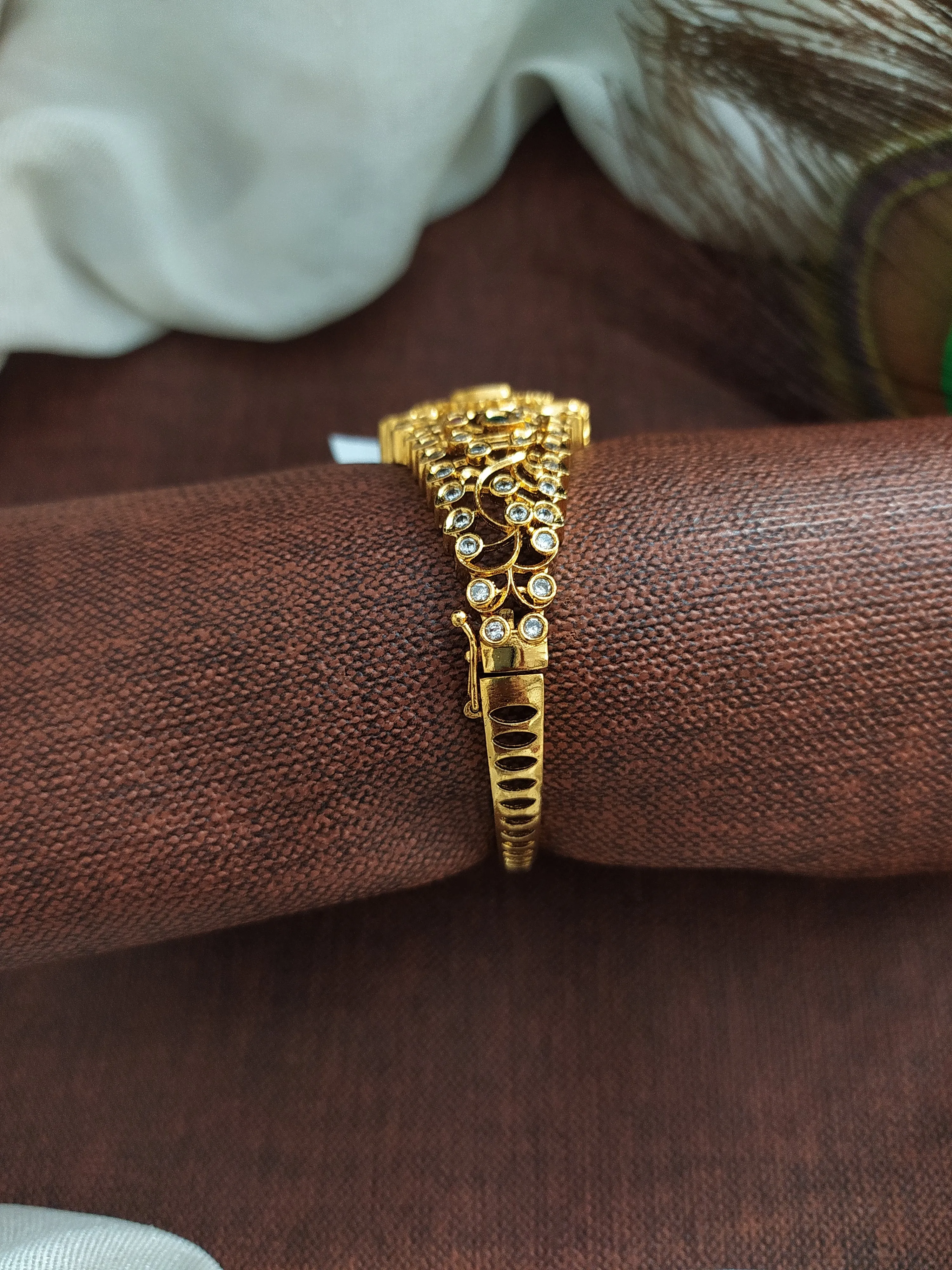 Antique Floral Designed Half Kada Crafted with Kemp and White Stones