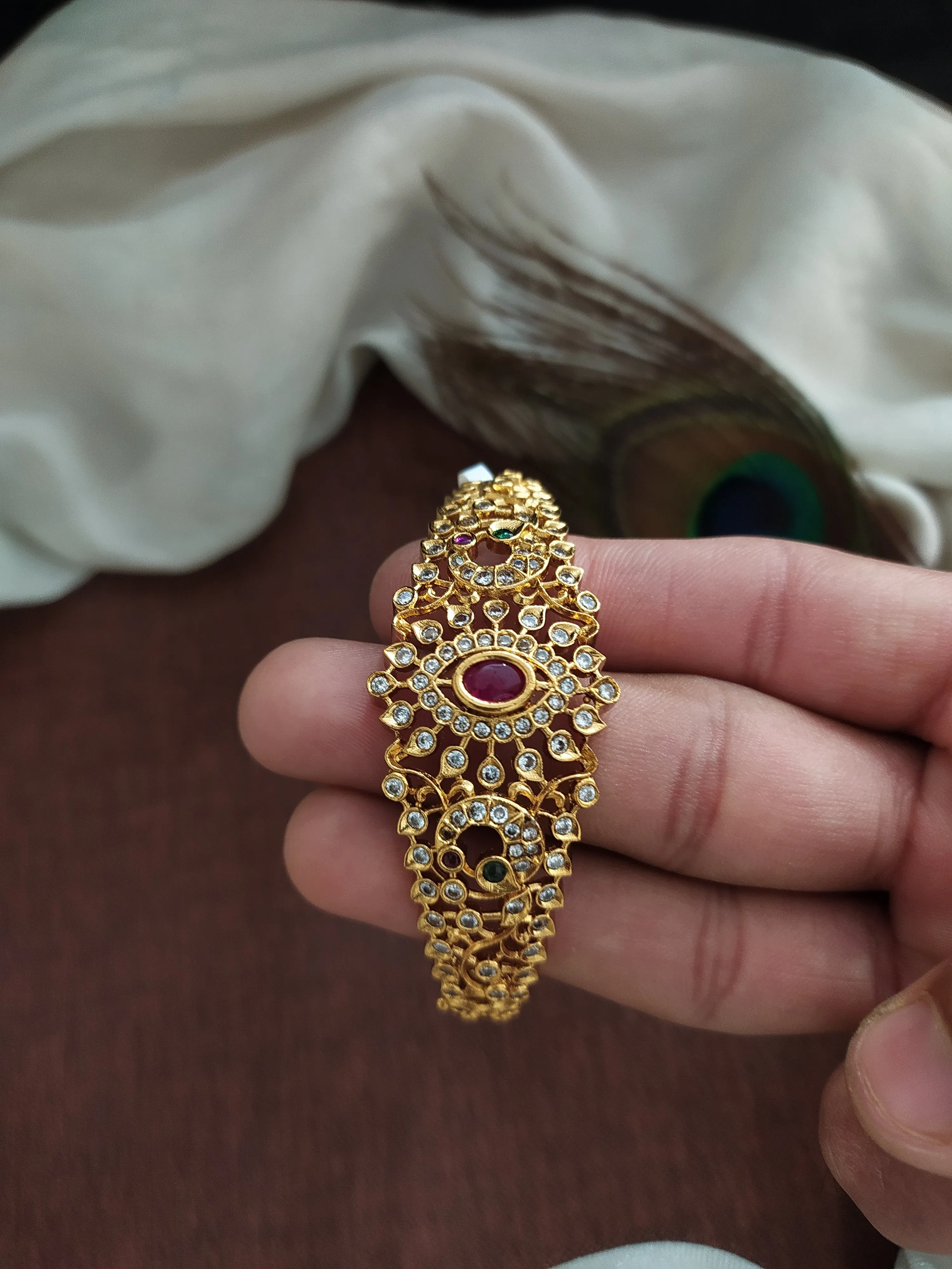 Antique Floral Designed Half Kada Crafted with Kemp and White Stones