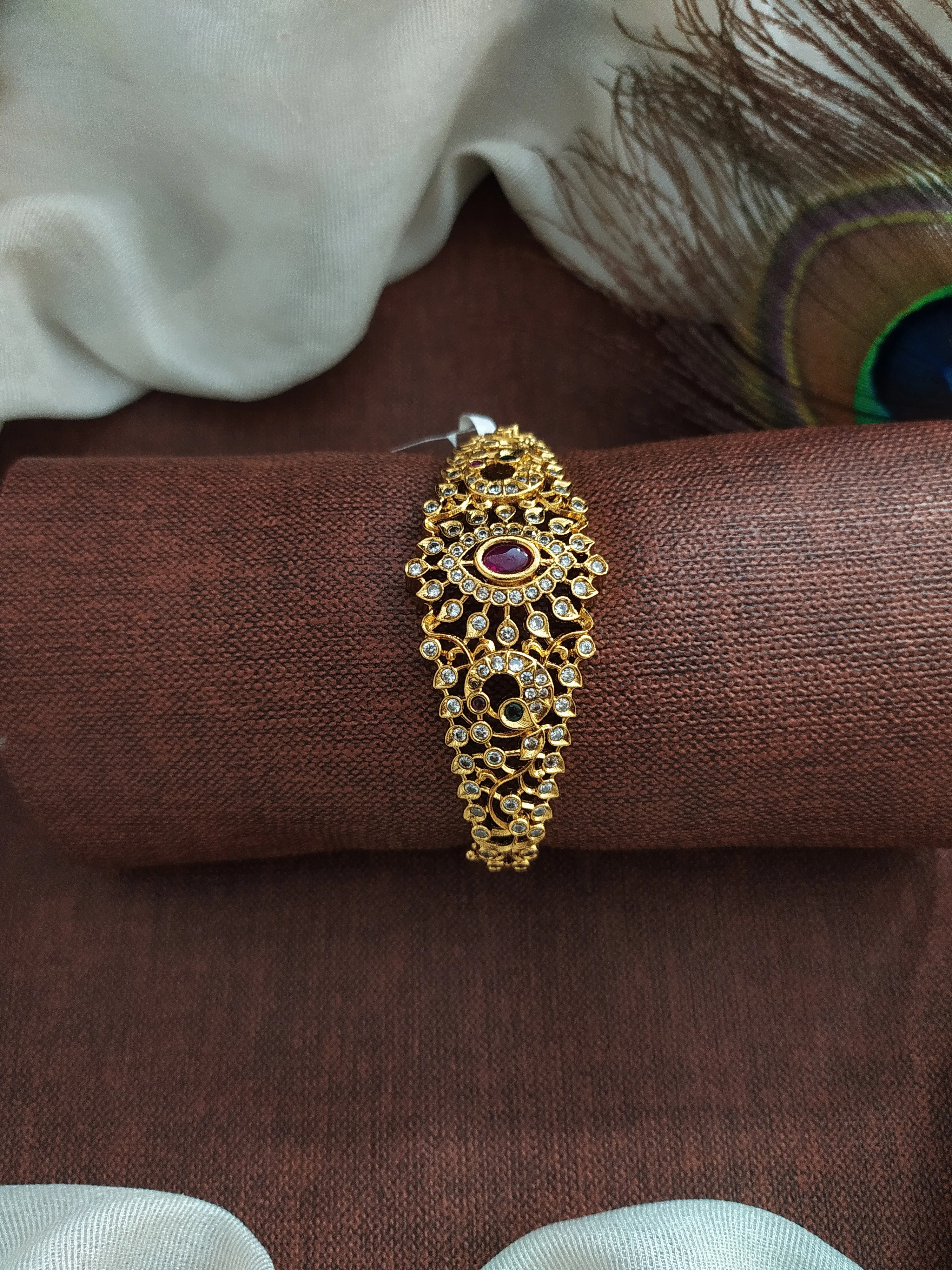 Antique Floral Designed Half Kada Crafted with Kemp and White Stones