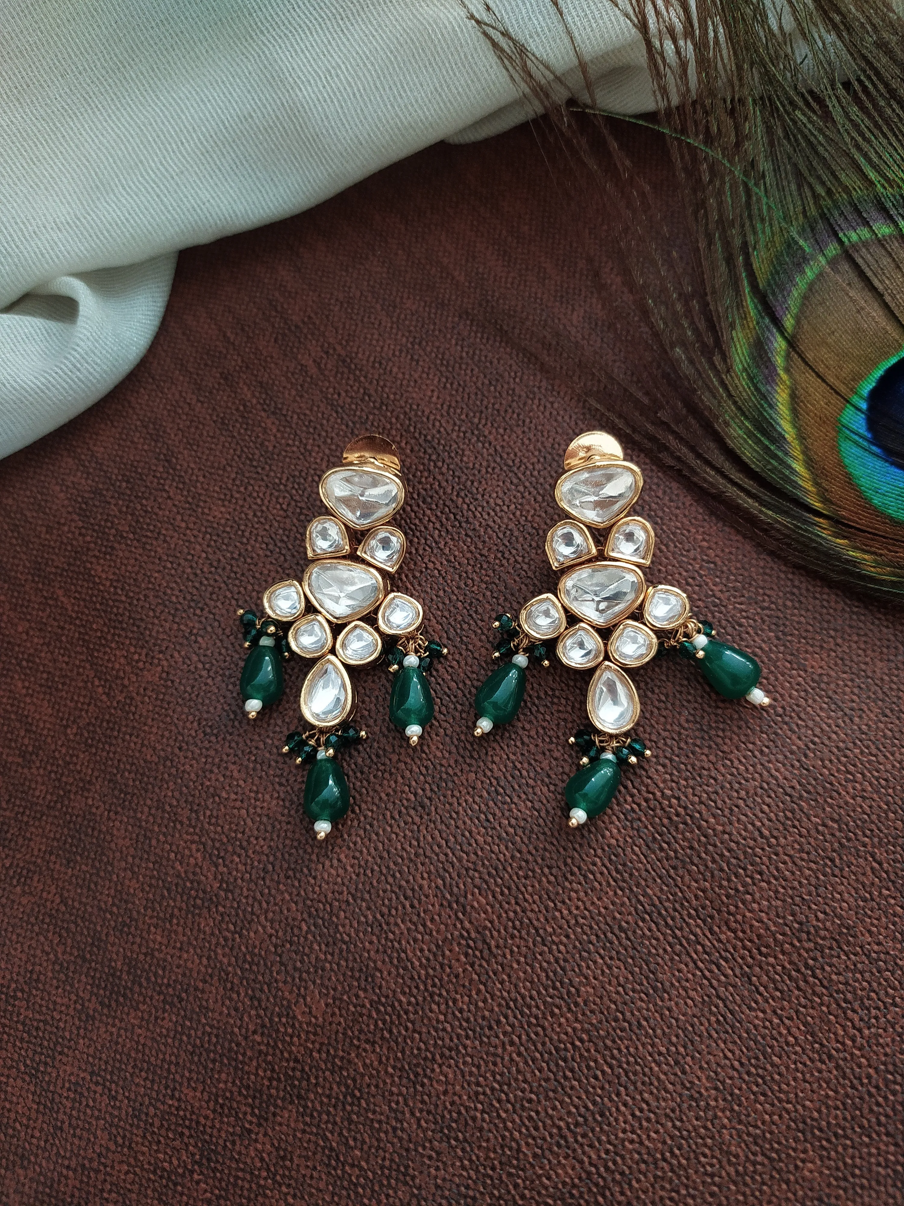 U-Shaped Kundan White Long Haram Set with Green Pear-Shaped Beads