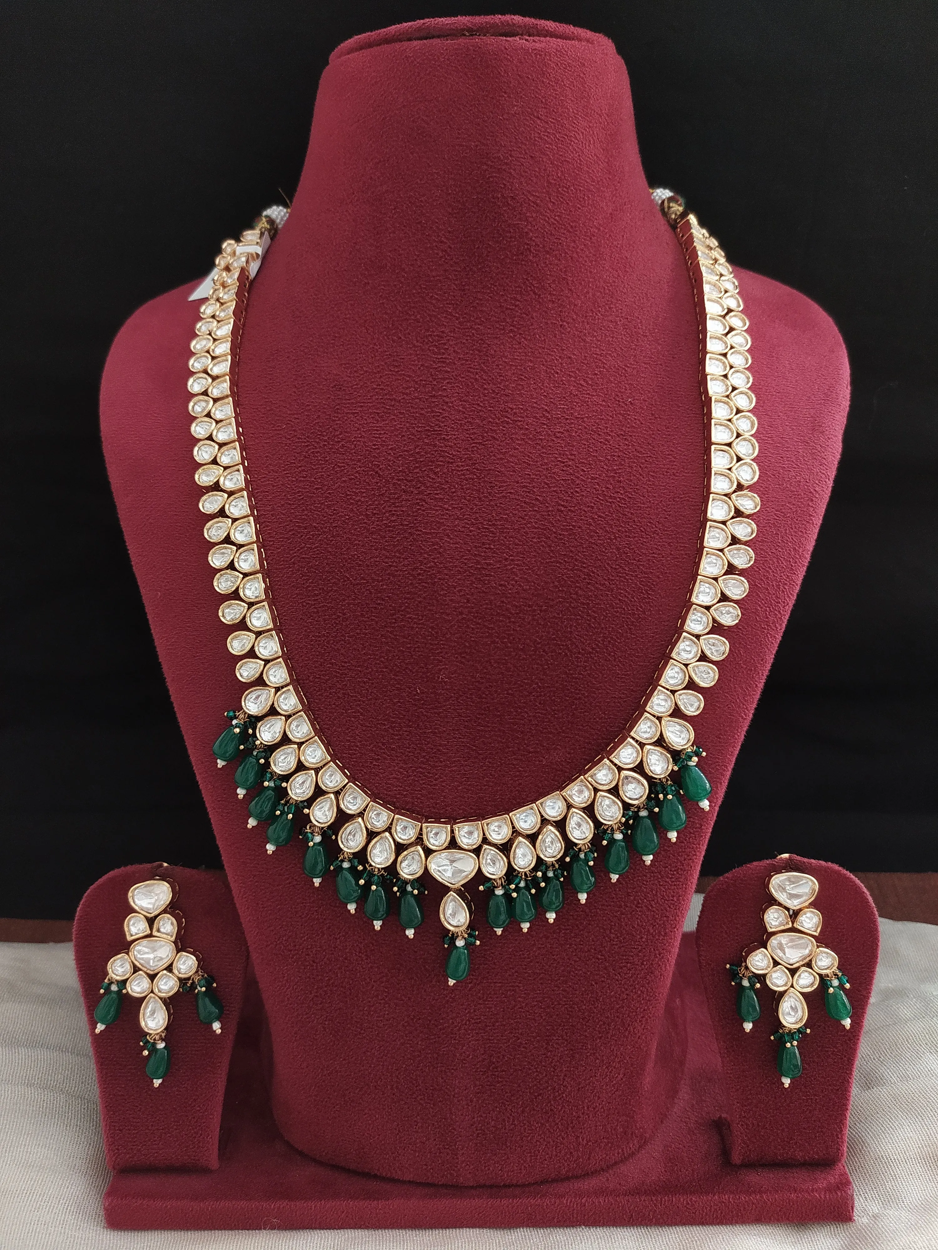 U-Shaped Kundan White Long Haram Set with Green Pear-Shaped Beads